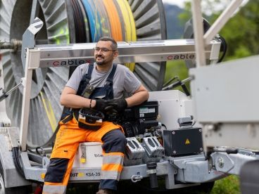 cablex technician with cable reel in the background.