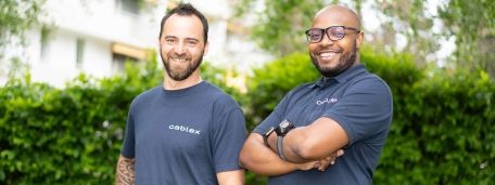 Two cablex staff smile at camera.